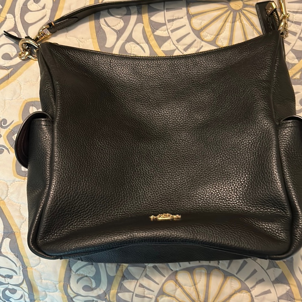 Black pebbled leather Coach purse with brown stitching